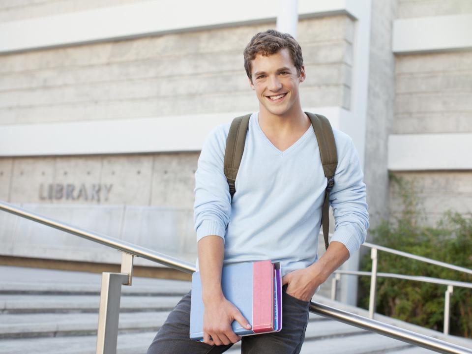 College student standing on steps