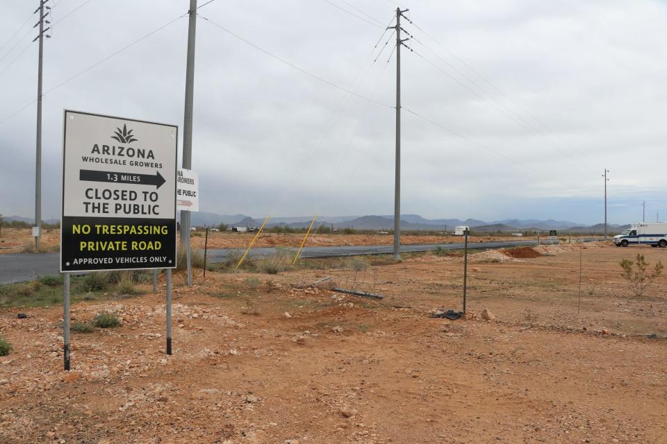Signage Arizona Wholesale Growers posted off Maddock and New River roads in the north Valley warns people, largely campers, not to use the company’s private entrance. Company employees drive the 1.3-mile stretch of road to get to its farm.