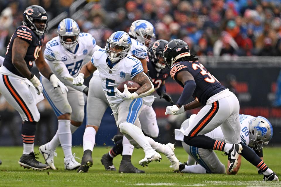 Lions running back David Montgomery runs the ball for a first down during the second quarter on Sunday, Dec. 10, 2023, in Chicago.
