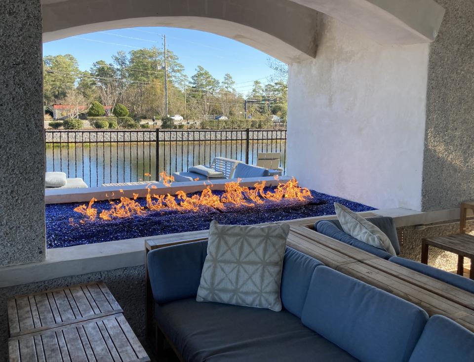 The fireplace on the covered patio at Blue Surf Arboretum West at 414 Arboretum Drive in 2021.
