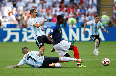 Soccer Football - World Cup - Round of 16 - France vs Argentina - Kazan Arena, Kazan, Russia - June 30, 2018 France's Paul Pogba in action with Argentina's Angel Di Maria and Ever Banega REUTERS/Michael Dalder