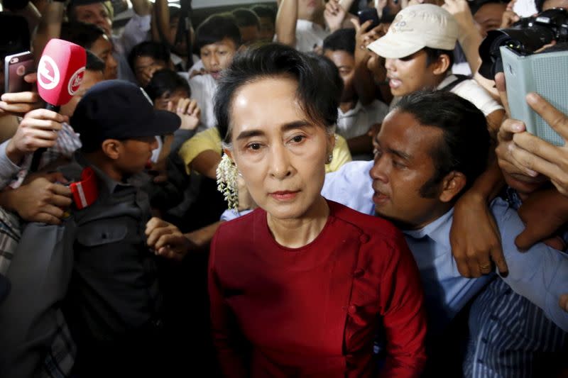 FILE PHOTO: Myanmar's National League for Democracy party leader Aung San Suu Kyi arrives to cast her ballot during the general election in Yangon