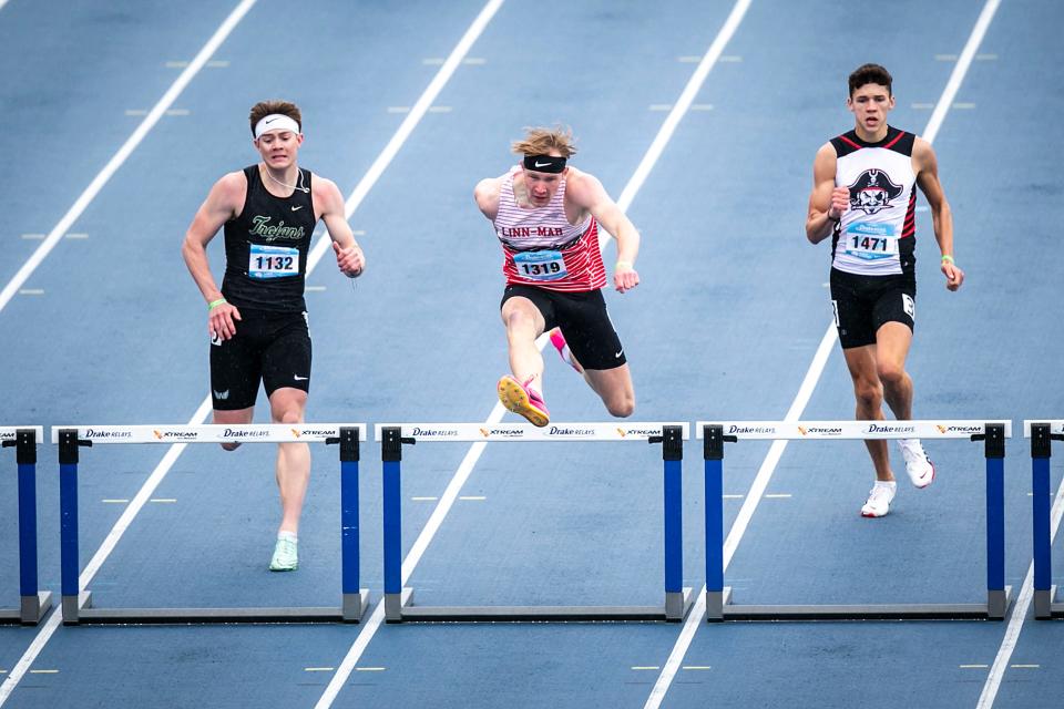 Iowa City West's Aidan Jacobsen, left, competes in the 400-meter hurdles during the 2023 Drake Relays on Saturday, April 29, 2023, at Drake Stadium in Des Moines, Iowa.