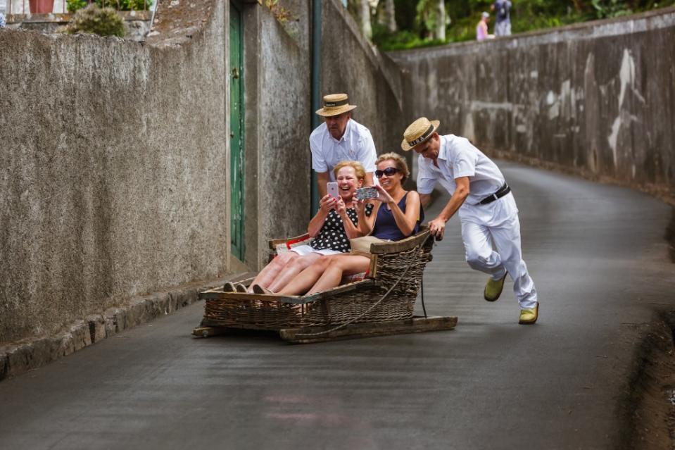 It’s all down here from here … quickly get from Monte Church to Funchal via “sledge” piloted by two blanched blokes. Shutterstock