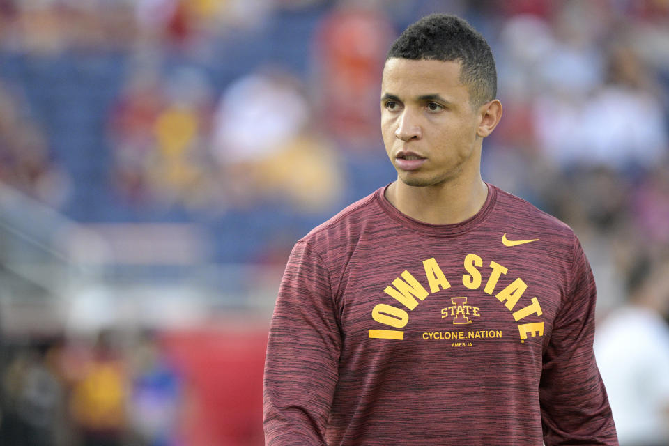 FILE - Iowa State running game coordinator Nate Scheelhaase watches players warm up before the Cheez-It Bowl NCAA college football game against Clemson, Wednesday, Dec. 29, 2021, in Orlando, Fla. Iowa State's primary focus in spring practice has been to improve an offense that struggled as the Cyclones made a fast descent to the bottom of the Big 12 last season. (AP Photo/Phelan M. Ebenhack, File)