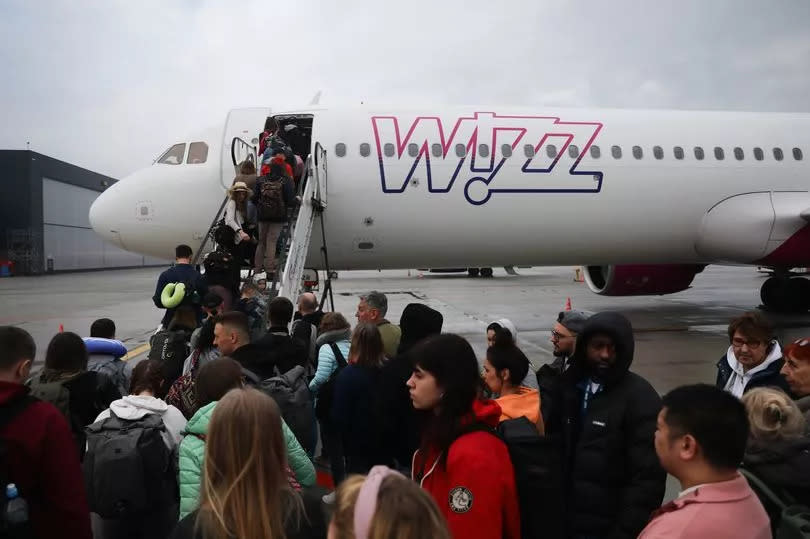 People board Wizz Air plane on the airport in Katowice, Poland on February 28, 2024. (Photo by Jakub Porzycki/NurPhoto via Getty Images)