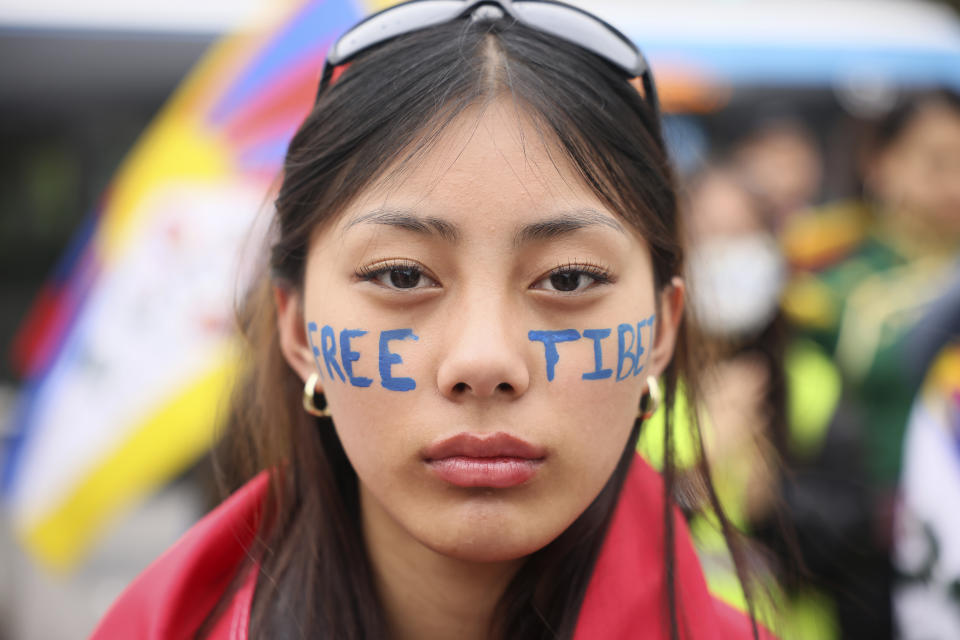 A Tibetan woman demonstrates Sunday, May 5, 2024 in Paris. French President Emmanuel Macron is welcoming China's Xi Jinping for a two-day state visit to France. The state visit marks the 60th anniversary of diplomatic relations between the two countries and follows Macron's trip to China in April 2023. (AP Photo/Thomas Padilla)