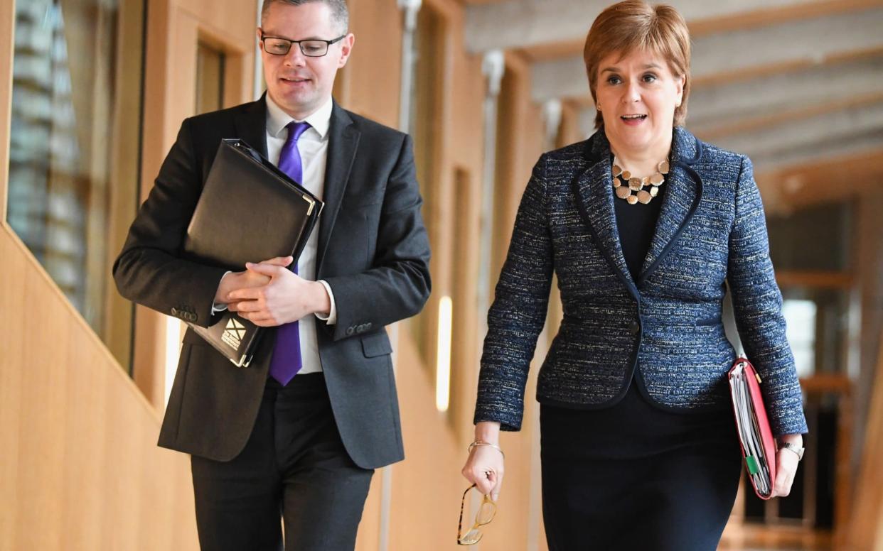 Finance Minister Derek Mackay and First Minister of Scotland Nicola Sturgeon arrive at the Scottish Parliament during final stage of Scottish Budget - Getty Images Europe