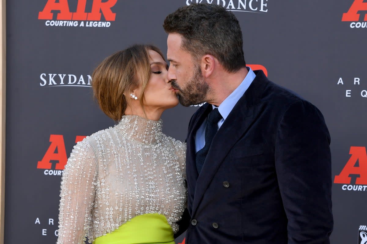 Jennifer Lopez and Ben Affleck took some time to display affection on the red carpet  (Getty Images)