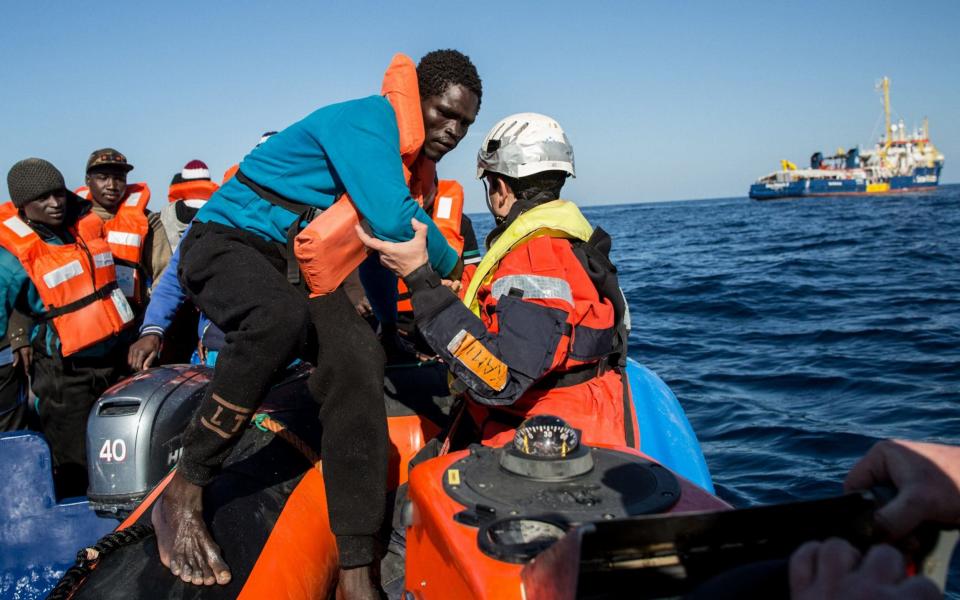 A group of 47 migrants is transfered from a rescued inflatable boat during a rescue operation by the Dutch-flagged vessel Sea Watch 3 off Libya's coasts on January 19 - AFP