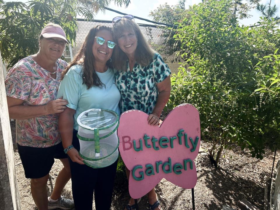 Volunteers Sherri Williams, Tamara Gibbs and Elizabeth Wilkerson (left to right) of The Florida Native Butterfly Society pose in front of their new butterfly garden at Shell Factory Nature Park.