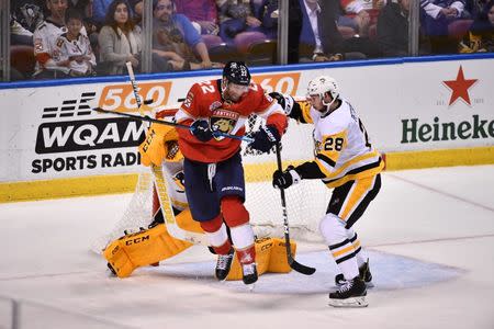 Feb 7, 2019; Sunrise, FL, USA; Florida Panthers right wing Troy Brouwer (22) attempts to deflect the puck on Pittsburgh Penguins goaltender Casey DeSmith (1) during the third period at BB&T Center. Mandatory Credit: Jasen Vinlove-USA TODAY Sports