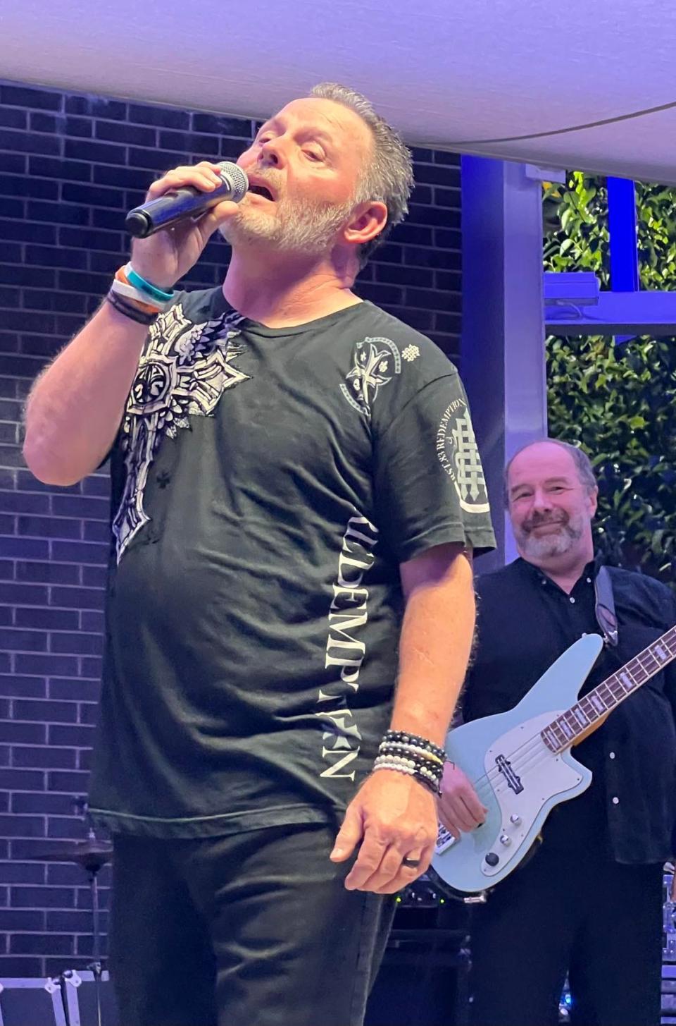 The lead singer of ZYGRT performs Friday night at Centennial Plaza during the Downtown Canton Music Fest. The tribute band plays Led Zeppelin, Yes, Genesis, Rush and Toto songs.