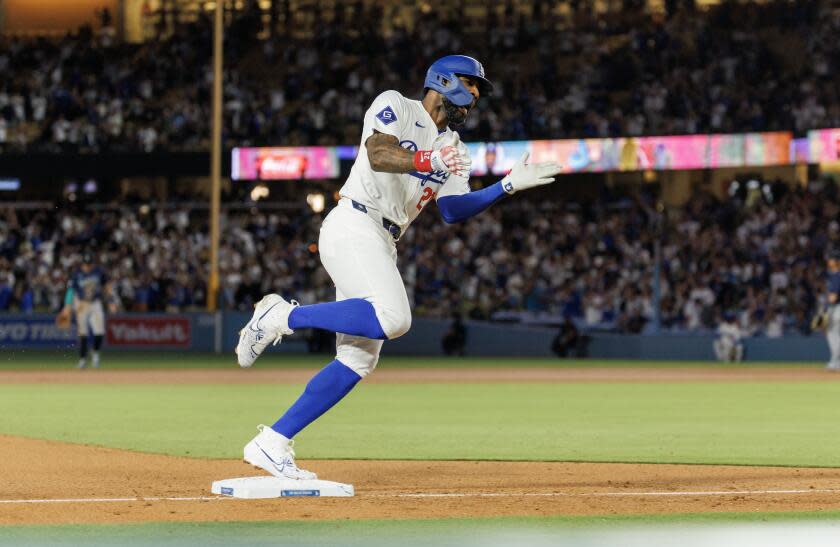 LOS ANGELS, CA - AUGUST 20, 2024: Los Angeles Dodgers Jason Heyward (23) reacts as he rounds third base after hitting a 3-run pinch hit homer to give the Dodgers a 6-3 win over the Seattle Mariners in the bottom of the eighth inning at Dodgers Stadium on August 20, 2024 in Los Angeles, California. (Gina Ferazzi / Los Angeles Times)