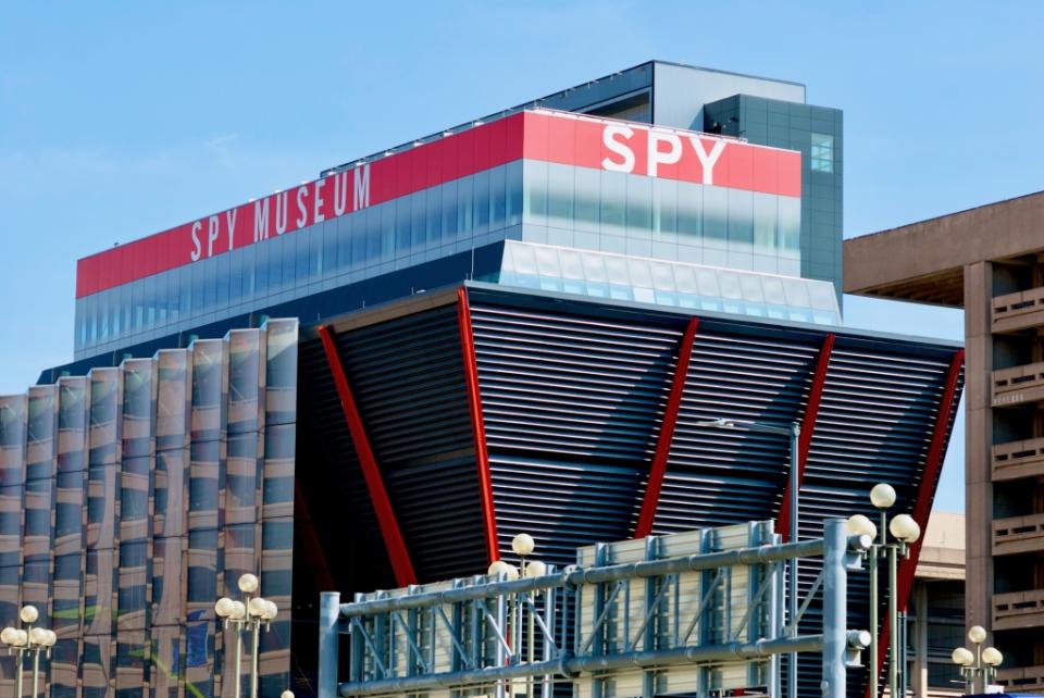 Washington, D.C., USA – April 14, 2022: The brightly colored red top of the International Spy Museum is easy to see on a bright day in downtown Washington, D.C.