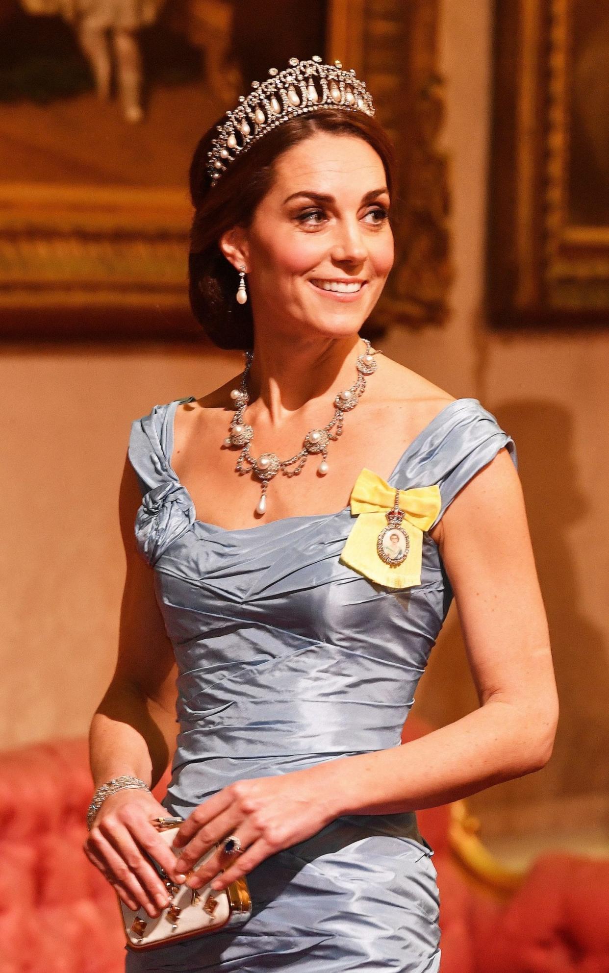 The Duchess of Cambridge wearing the Lover's Knot tiara, Princess Diana's pearl earrings and Queen Alexandra's wedding necklace at a state banquet for the King and Queen of the Netherlands - Getty Images Europe
