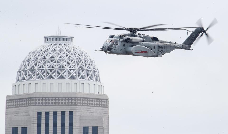 A USN-053 practices over downtown Louisville for Thunder Over Louisville air show on Friday, April 19, 2024