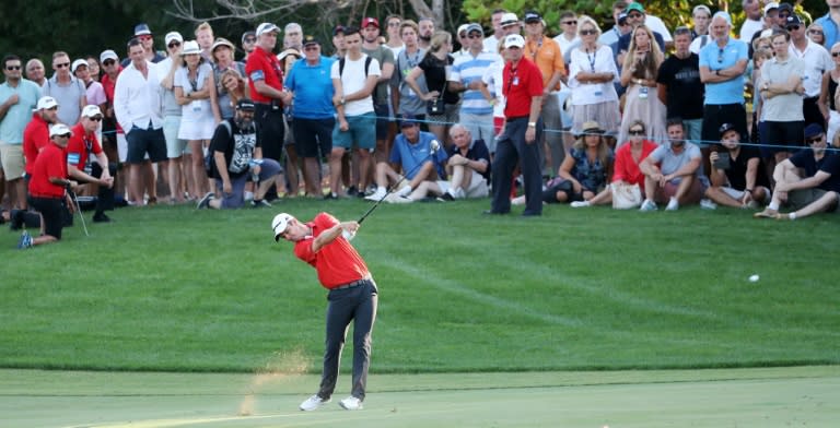 Justin Rose of England plays a shot during the third round of the DP World Tour Championship at Jumeirah Golf Estates in Dubai on November 18, 2017