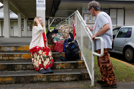 Carolyn McNamara, 70, talks with her neighbour, Paul Campbell, 68, at an evacuation center in Pahoa after moving out of their homes in Leilani Estates after the Kilauea Volcano erupted on Thursday after a series of earthquakes over the last couple of days, in Hawaii, U.S., May 4, 2018. REUTERS/Terray Sylvester