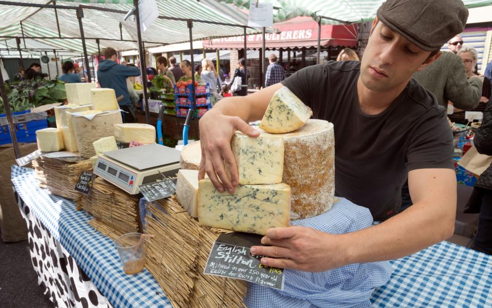 English Blue Stilton cheese for sale at Broadway Market, Hackney, London, England, UK - Alex Segre/Alamy Stock Photo