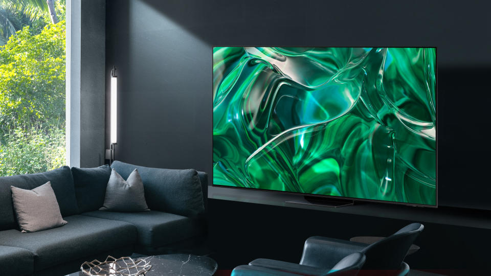 The Samsung S95C OLED TV sitting in a living room.