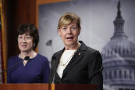 Sen. Tammy Baldwin, D-Wis., joined at left by Sen. Susan Collins, R-Maine, speaks to reporters following Senate passage of the Respect for Marriage Act, at the Capitol in Washington, Tuesday, Nov. 29, 2022. (AP Photo/J. Scott Applewhite)