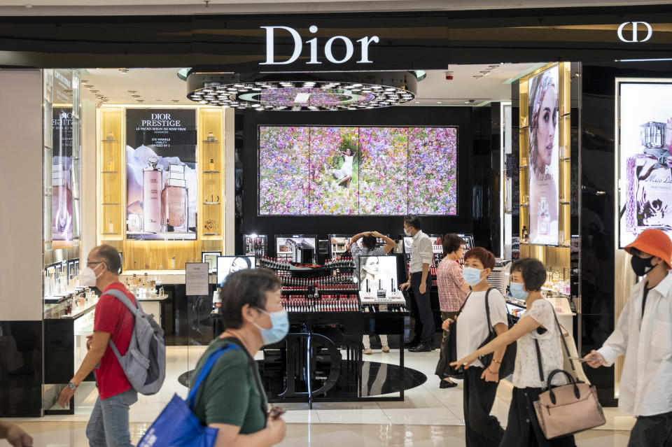 HONG KONG, CHINA - 2022/08/19: Shoppers walk past the French Christian Dior luxury goods, clothing and beauty products store in Hong Kong. (Photo by Budrul Chukrut/SOPA Images/LightRocket via Getty Images)