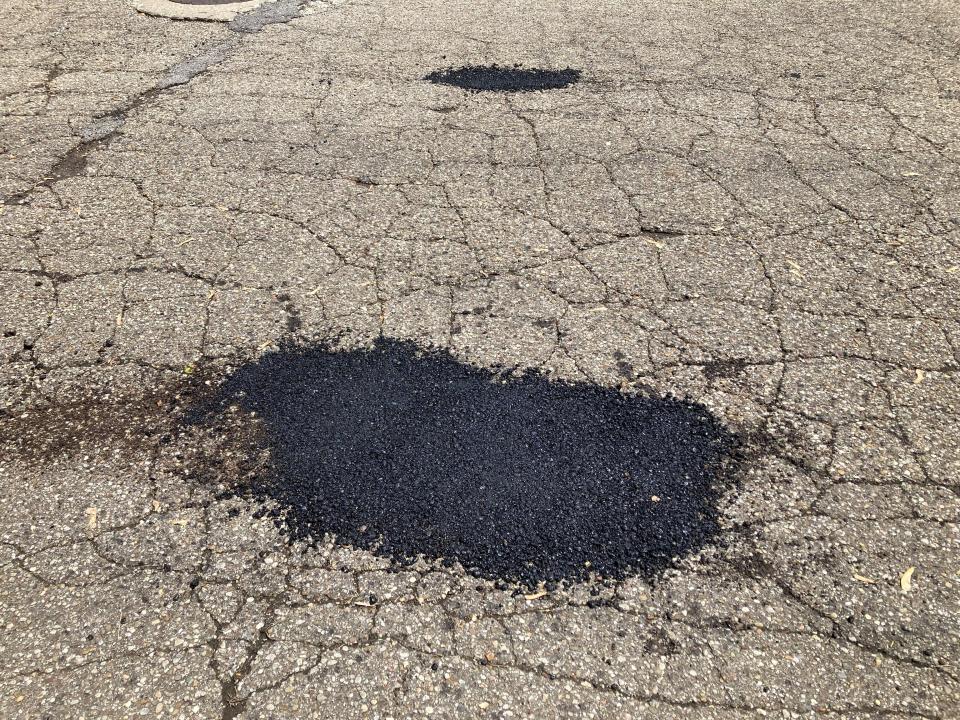 The Lancaster Street Department patched a road in front of John Craig's house.