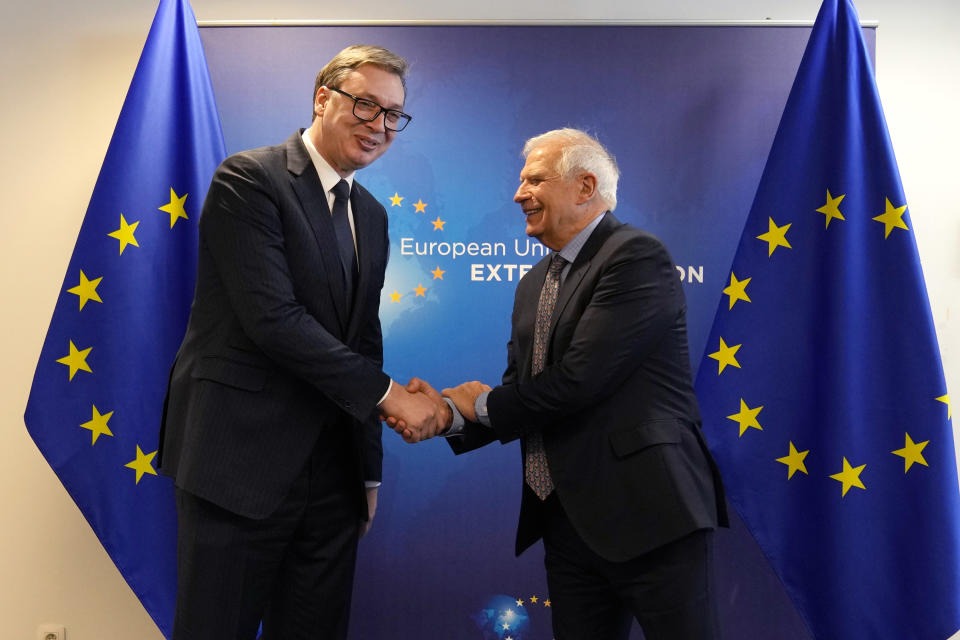 Serbian President Aleksandar Vucic, left, shakes hands with European Union foreign policy chief Josep Borrell prior to a meeting in Brussels, Monday, Feb. 27, 2023. The leaders of Serbia and Kosovo are holding talks Monday on European Union proposals aimed at ending a long series of political crises and setting the two on the path to better relations and ultimately mutual recognition. (AP Photo/Virginia Mayo)