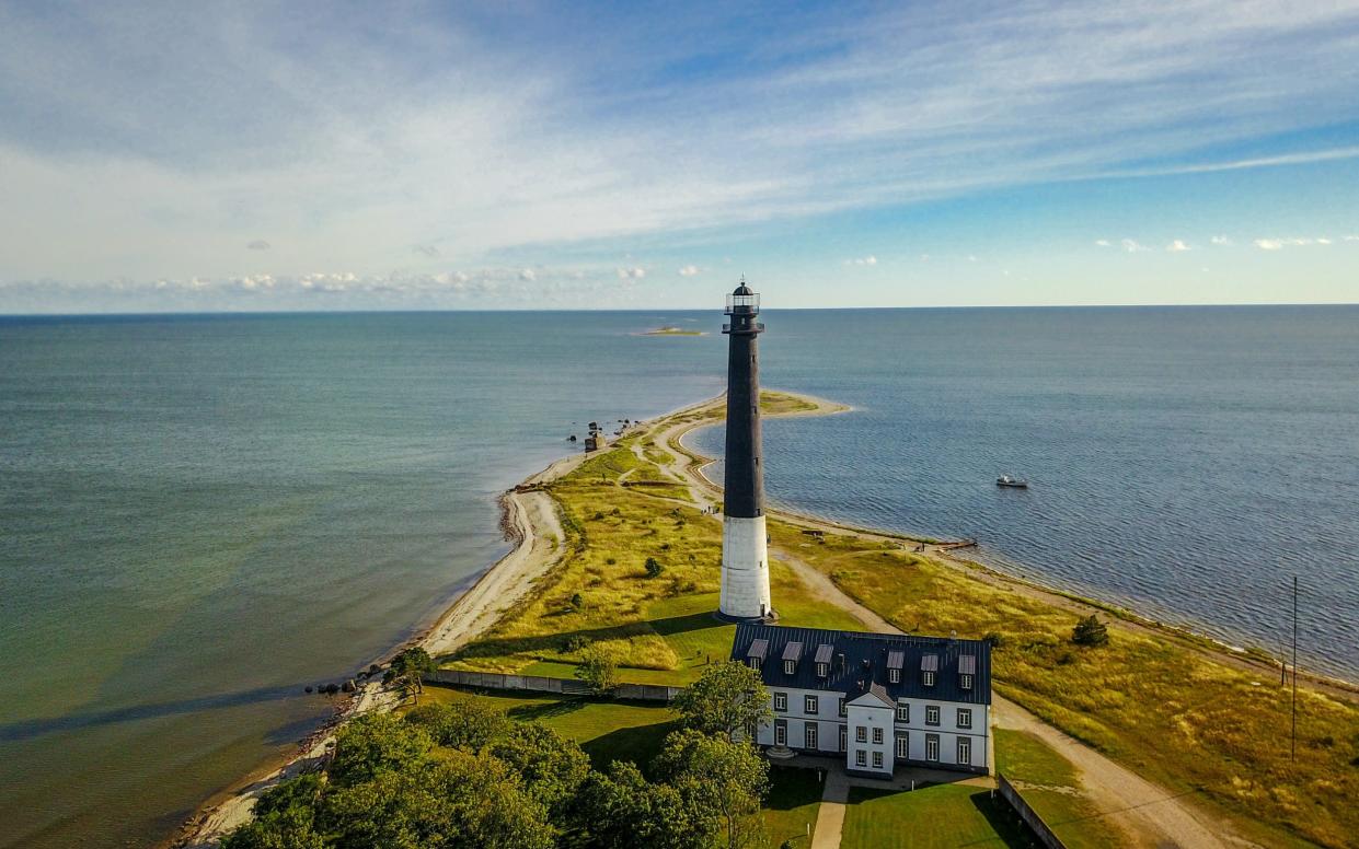 The image shows the lighthouse located on the southern tip of the peninsula on the island of Saaremaa , aerial view