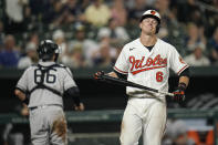 Baltimore Orioles' Ryan Mountcastle (6) reacts after striking out to end the seventh inning as New York Yankees catcher Kyle Higashioka (66) runs to the dugout during a baseball game, Tuesday, Sept. 14, 2021, in Baltimore. (AP Photo/Julio Cortez)
