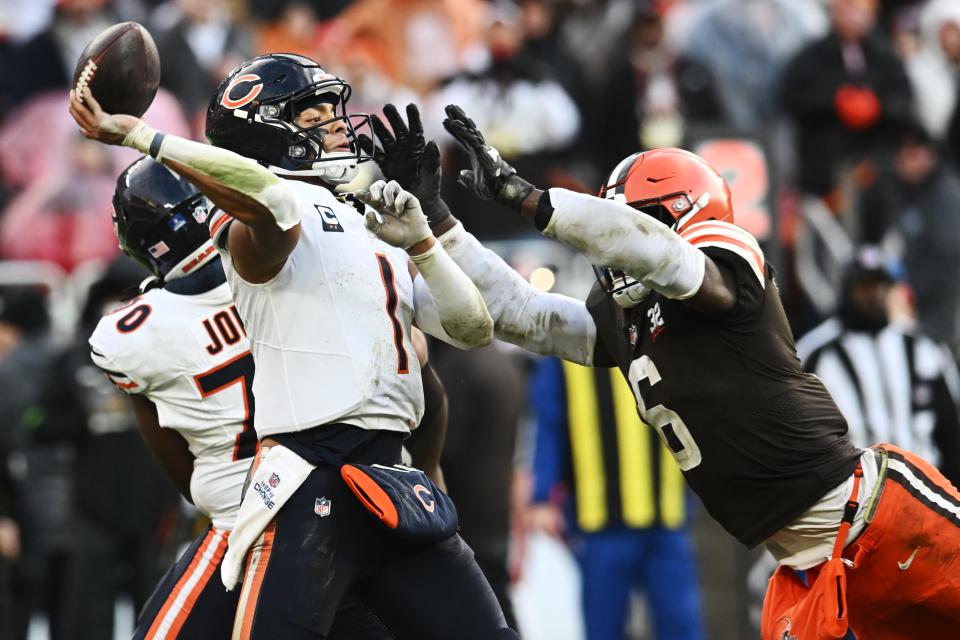 Bears quarterback Justin Fields throws a second-half pass as Browns linebacker Jeremiah Owusu-Koramoah rushes, Dec. 17, 2023, in Cleveland.