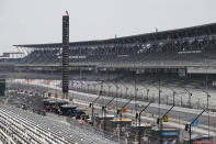 Race driver Dalton Kellett, of Canada, drives down the main straight in front of empty stands during the IndyCar auto race at Indianapolis Motor Speedway in Indianapolis, Saturday, July 4, 2020. No fans where allowed due to the coronavirus pandemic. (AP Photo/Darron Cummings)