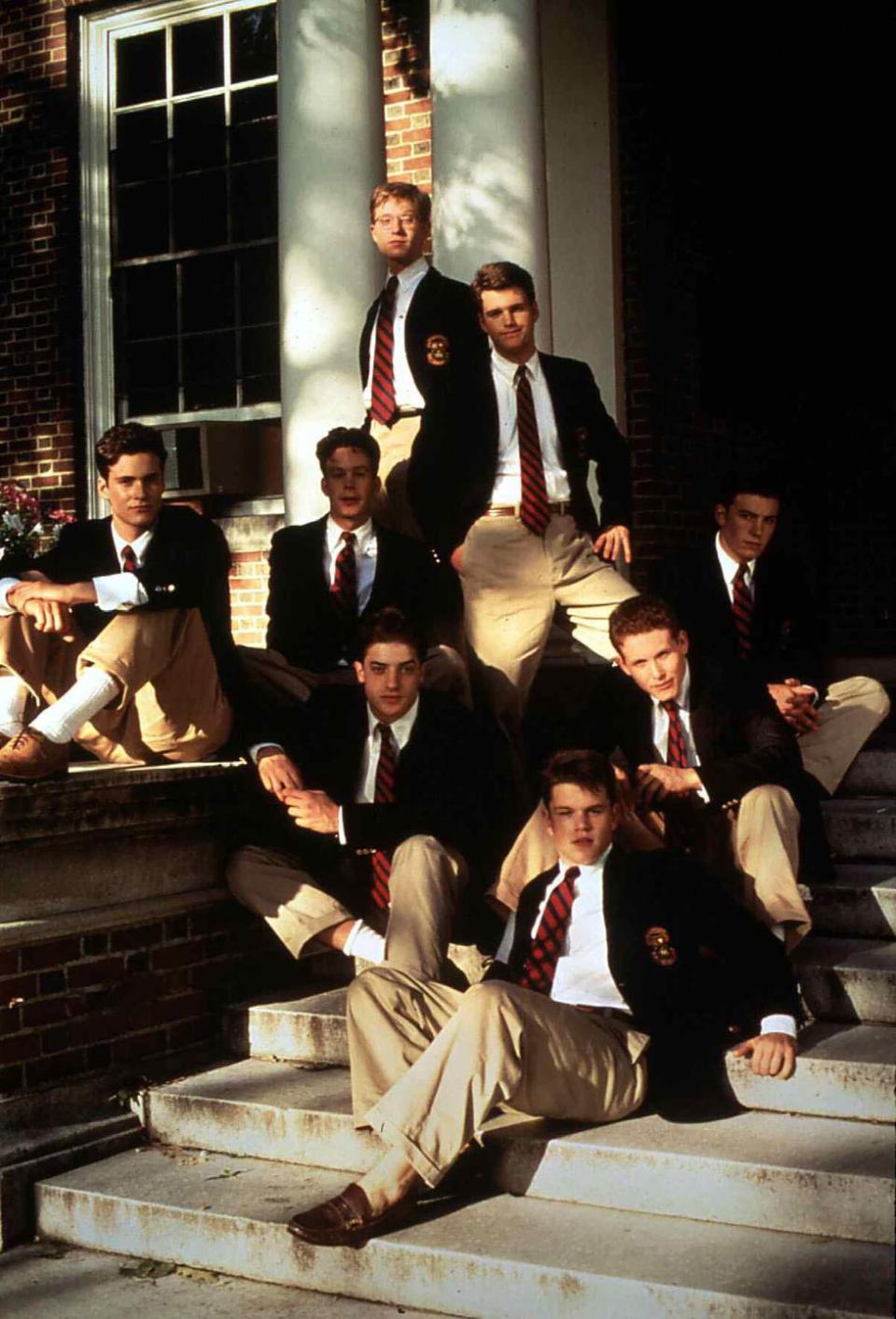 a publicity photo from the movie school ties featuring several male characters in blazers and ties sitting on the steps of a prep school, matt damon and ben affleck are two of the characters