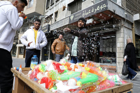 War-wounded Abdullah Ayed, 21 year-old man from Yemen, tours the downtown with his brother, in Amman, Jordan March 4, 2019. Picture taken March 4, 2019. REUTERS/Muhammad Hamed