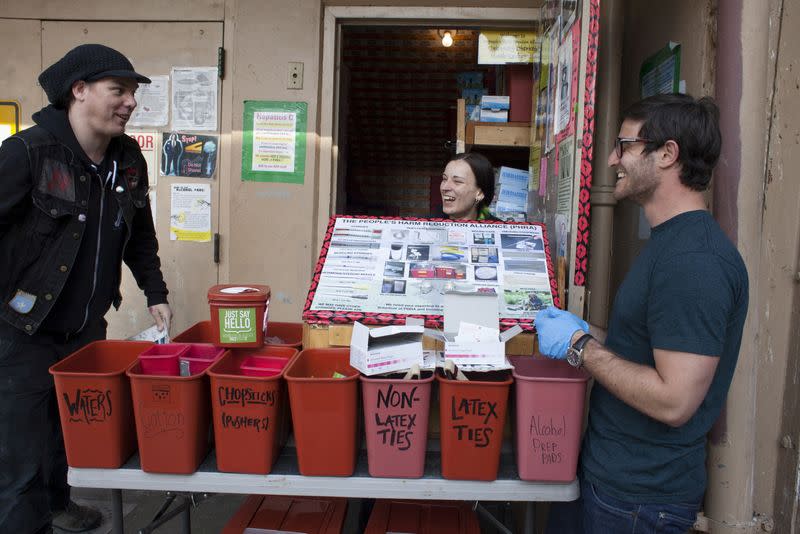 (L to R) Shilo Murphy, Misty Kohal, and Jeff Sablosky prepare to open the People's Harm Reduction Alliance, the nation's largest needle-exchange program, in Seattle, Washington