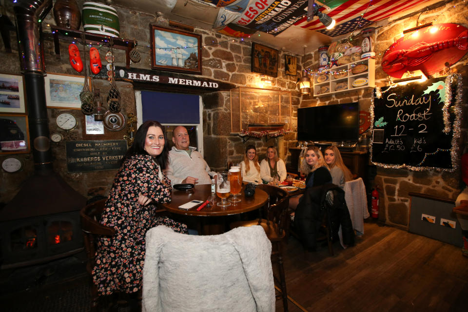 People enjoying pints in a pub indoors has become a novelty in England. (Chris Hall/SWNS)