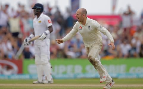 England's Jack Leach celebrates the dismissal of Sri Lanka's Kusal Mendis during the fourth day of the first test cricket match between Sri Lanka and England in Galle - Credit: AP Photo/Eranga Jayawardena