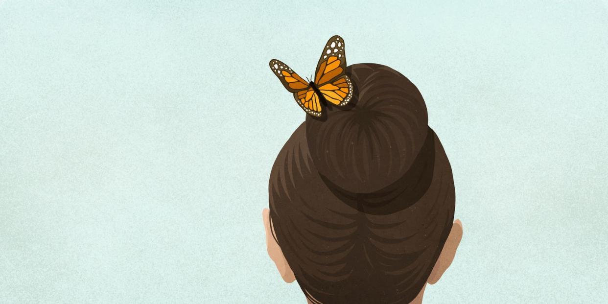butterfly in womans hair