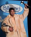 FILE - Usher poses backstage with his Artist of the Year award at the 1998 Billboard Music Awards in Las Vegas on Dec. 7, 1998. (AP Photo/Joey Terrill, File)