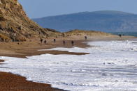 <p>Hengistsbury head is a sandy and pebbly beach that juts out into the sea in Bournemouth. It’s just as beautiful for a wind-whipped winter walk as a sunny days spent lounging in front of the rows of candy-coloured beach huts. (Geoffrey Swaine/Rex)</p>