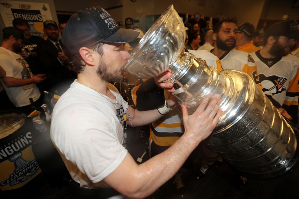 <p>Pittsburgh Penguins center Sidney Crosby drinks from the Stanley Cup after defeating the Nashville Predators in Game 6 of the 2017 Stanley Cup Final at Bridgestone Arena. Credit: Dave Sandford/NHLI/Pool Photo via USA TODAY Sports </p>