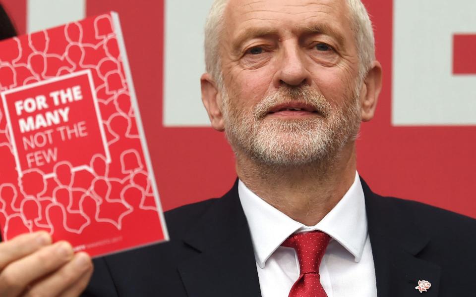 Jeremy Corbyn with the Labour manifesto - Credit: AFP PHOTO / PAUL ELLISPAUL ELLIS/AFP/Getty Images/AFP PHOTO / PAUL ELLISPAUL ELLIS/AFP/Getty Images