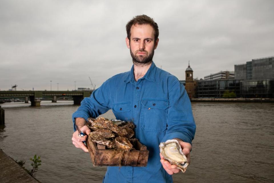 Oyster sommelier Bobby Groves by the Thames near Borough Market in London.