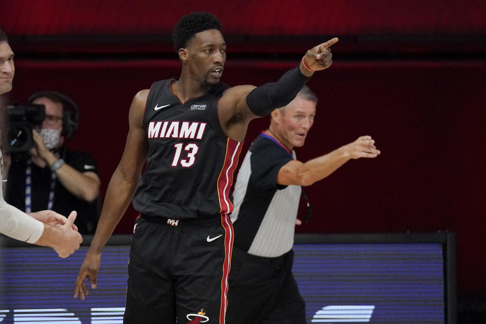 Miami Heat's Bam Adebayo (13) gestures after forcing a turnover by the Milwaukee Bucks in the first half of an NBA conference semifinal playoff basketball game Friday, Sept. 4, 2020, in Lake Buena Vista, Fla. (AP Photo/Mark J. Terrill)