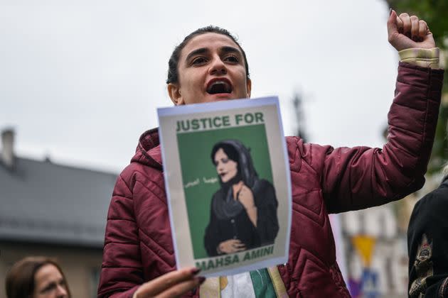 People hold banners during a solidarity protest on Sept. 25, 2022 in Krakow, Poland, for Mahsa Amini, a 22-year-old Iranian woman who died under custody by Iran's morality police for not wearing her hijab properly. Her death has sparked national protests, and the death toll has reached 35. (Photo: Omar Marques/Anadolu Agency via Getty Images)