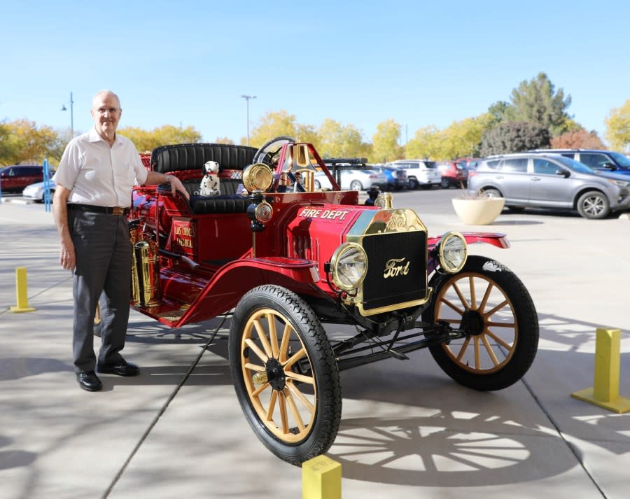 Wes Melo stands next to the 1915 American LaFrance/Ford Model-T fire engine.