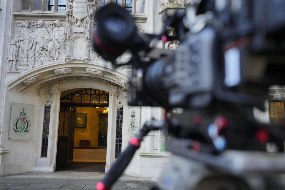 A camera focusses on the Supreme Court entrance in London, Wednesday, Nov. 15, 2023. Britain's highest court is set to rule Wednesday, Nov. 15 on whether the government's plan to send asylum-seekers to Rwanda is legal, delivering a boost or a blow to a contentious central policy of Prime Minister Rishi Sunak's administration. Five justices on the U.K. Supreme Court will deliver judgment in the government's attempt to overturn a lower court ruling that blocked deportations. (AP Photo/Kirsty Wigglesworth)