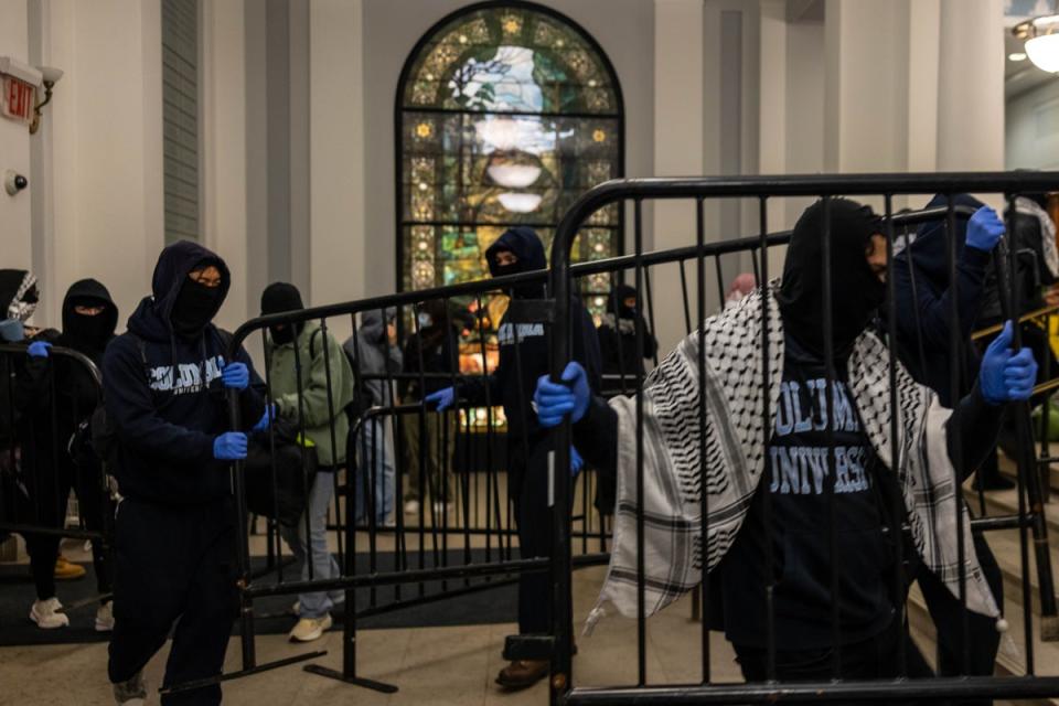 Demonstrators supporting Palestinians in Gaza barricade themselves inside Hamilton Hall, an academic building which has been occupied in past student movements, on April 30, 2024 in New York City (Getty Images)
