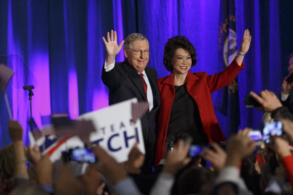 Senate Minority Leader Mitch McConnell of Kentucky, joined by his wife, former Labor Secretary Elaine Chao, celebrates with his supporters at an election night party in Louisville, Ky., on Nov. 4, 2014. (J. Scott Applewhite/AP)